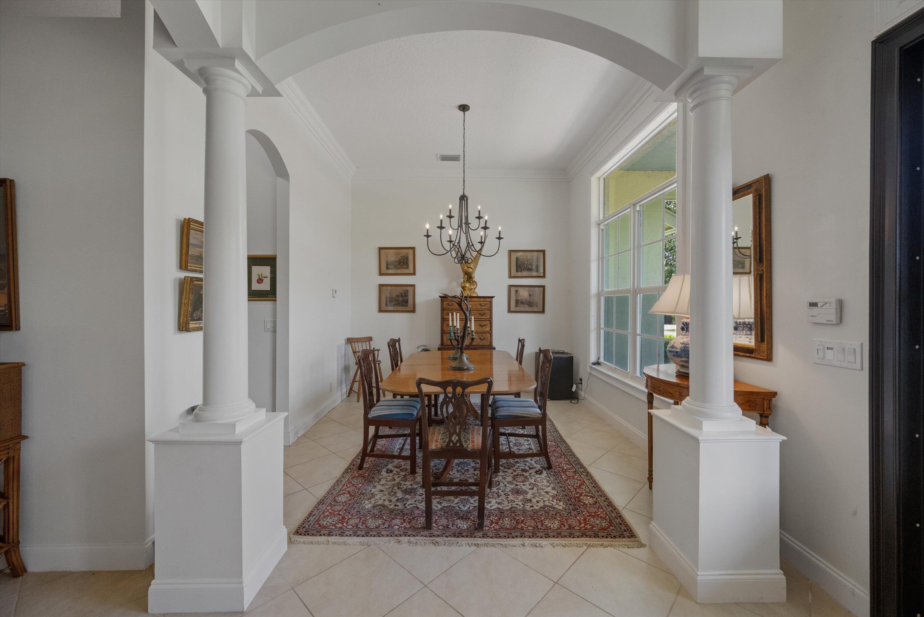 19986 Black Falcon Road Loxahatchee, FL 33470 - Photo 29 of 105 a view of a dining room with furniture and window