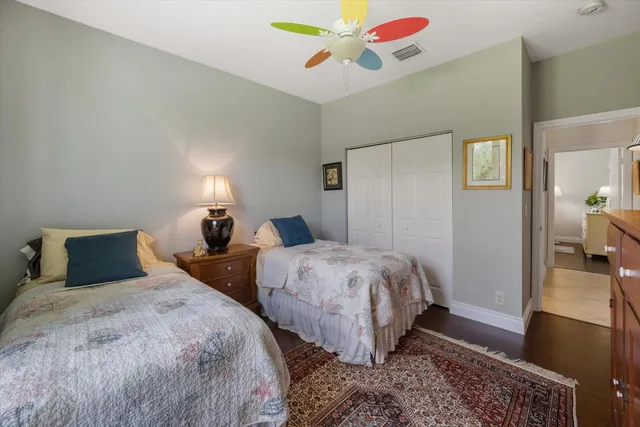 a view of walk in closet with clothes