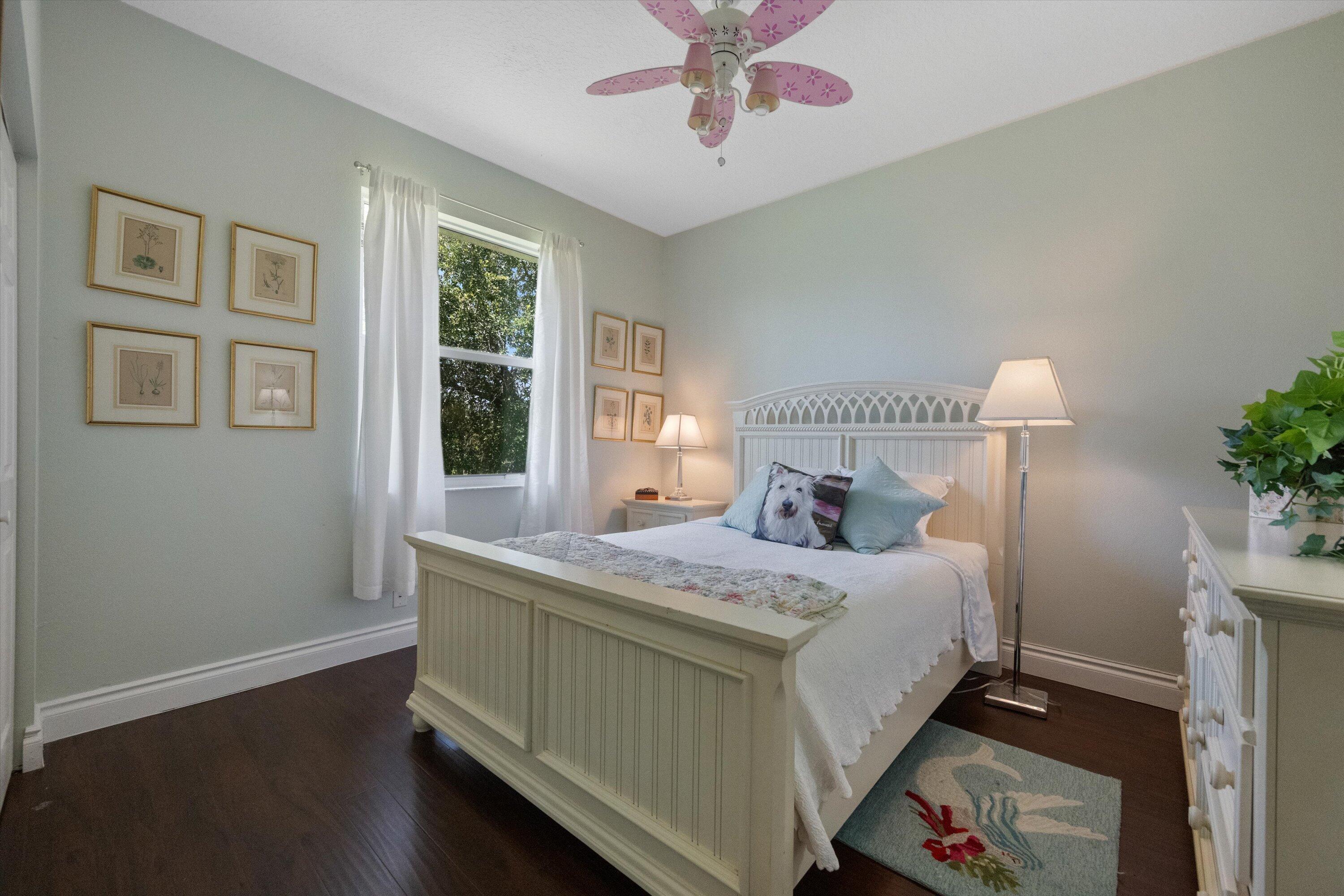 19986 Black Falcon Road Loxahatchee, FL 33470 - Photo 34 of 105 a bedroom with a bed and a window