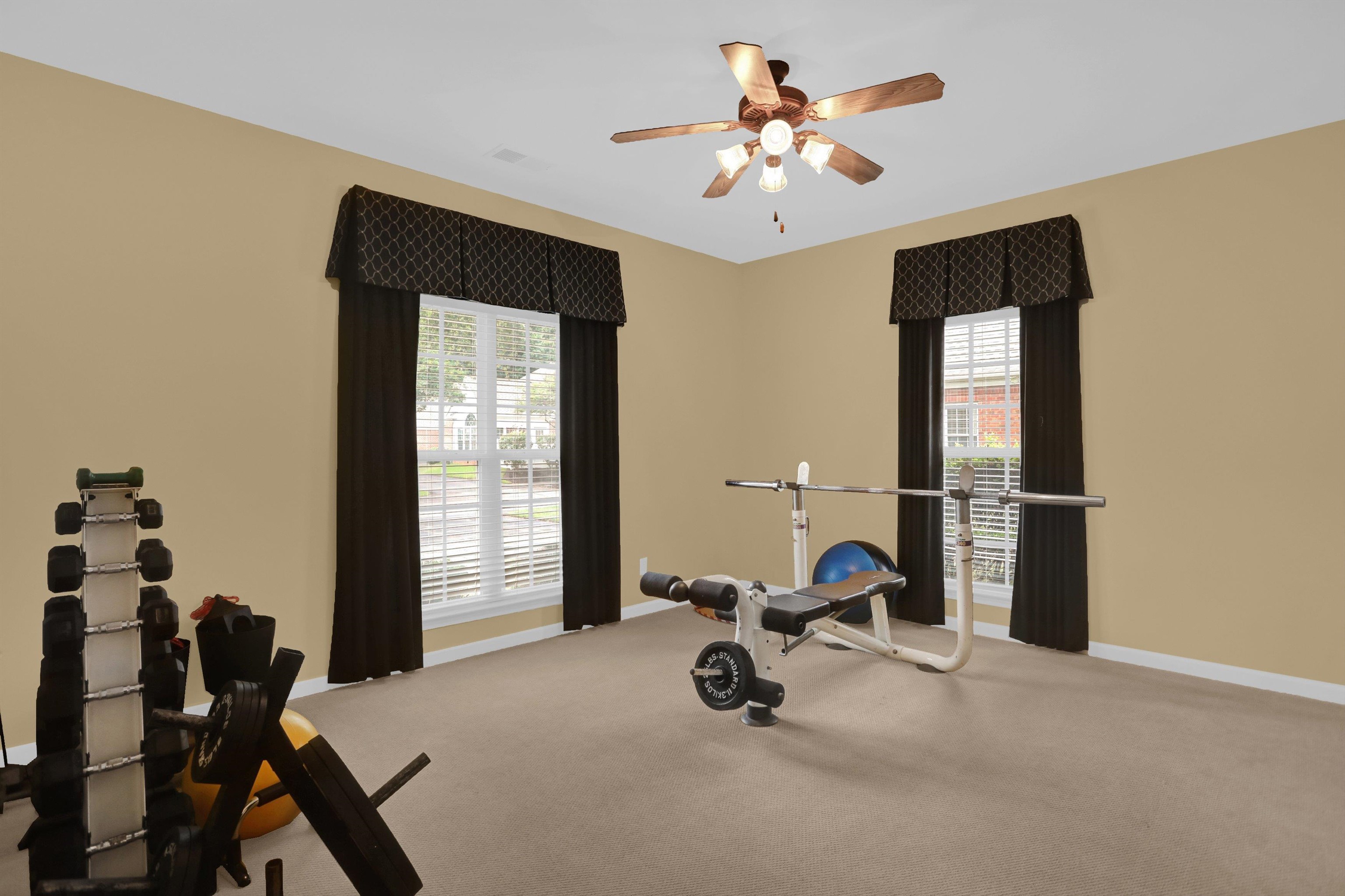 34 Peyton Ridge Drive, Unit 21 Collierville, TN 38017 - Photo 31 of 37 Carpeted room with a ceiling fan light fixture
