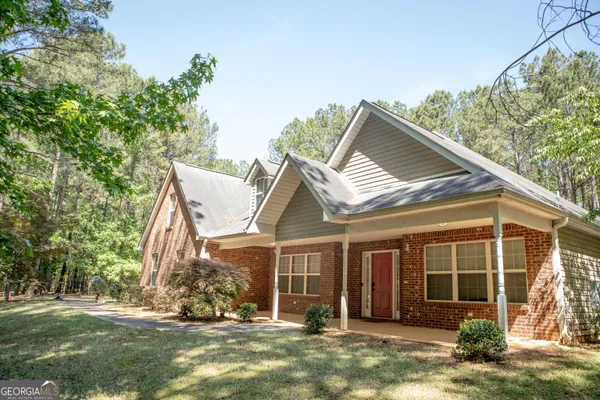 front view of a house with a yard