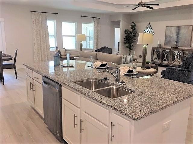 6074 Carina Road Crestview, FL 32539 - Photo 11 of 28 a kitchen with stainless steel appliances granite countertop a sink and a counter space