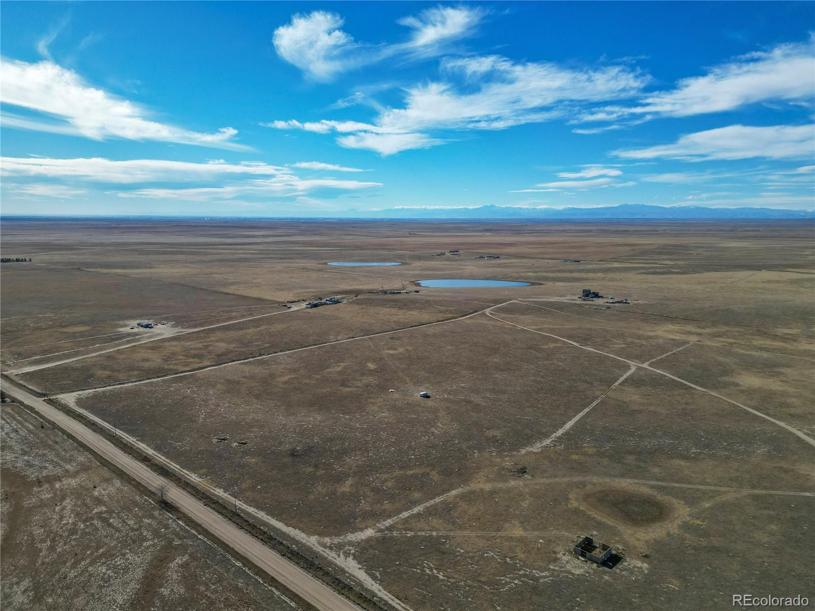 55 County Road Ault, CO 80610 - Photo 14 of 14 a view of an empty room with wooden floor