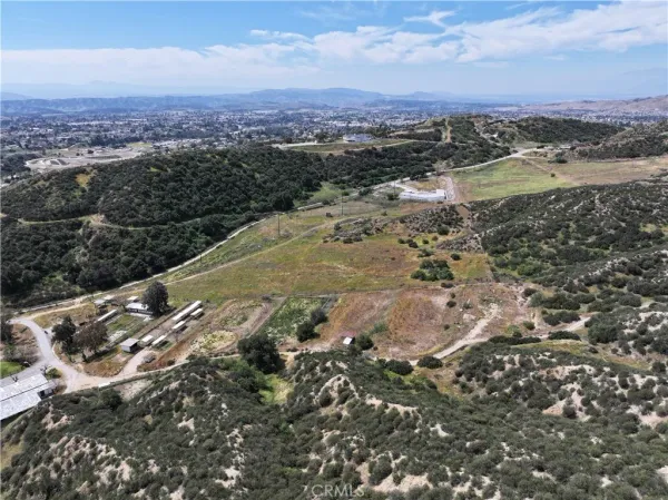 a view of a dry yard with mountains