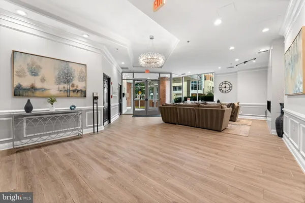 a living room with furniture and flat screen tv