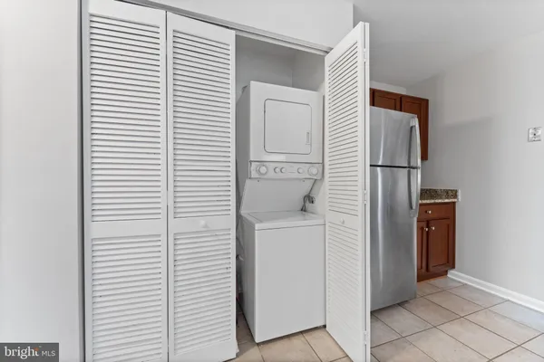 a view of a storage & utility room with washer and dryer