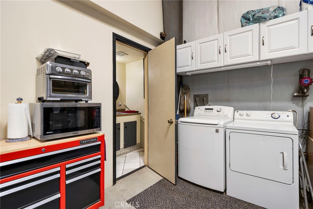 2883 Soledad Canyon Road Acton, CA 93510 - Photo 27 of 64 a utility room with dryer and washer