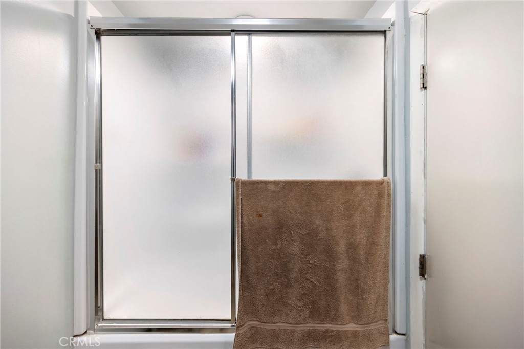 2883 Soledad Canyon Road Acton, CA 93510 - Photo 31 of 64 a bathroom with a glass shower door