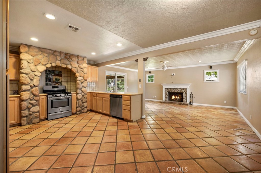 2883 Soledad Canyon Road Acton, CA 93510 - Photo 42 of 64 a kitchen with sink cabinets and stainless steel appliances