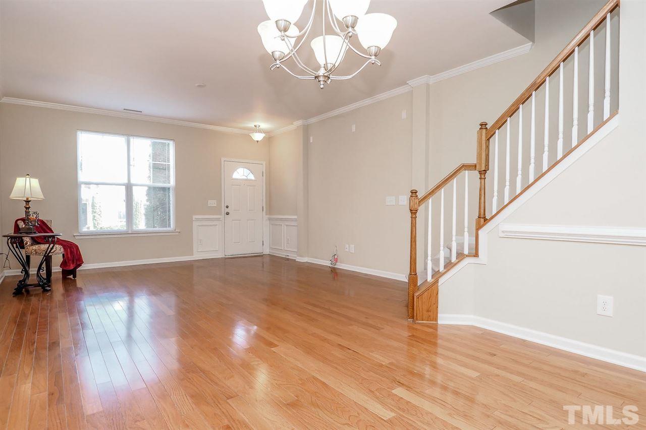 2965 Casona Way Raleigh, NC 27616 - Photo 12 of 25 a view of empty room with wooden floor and fan