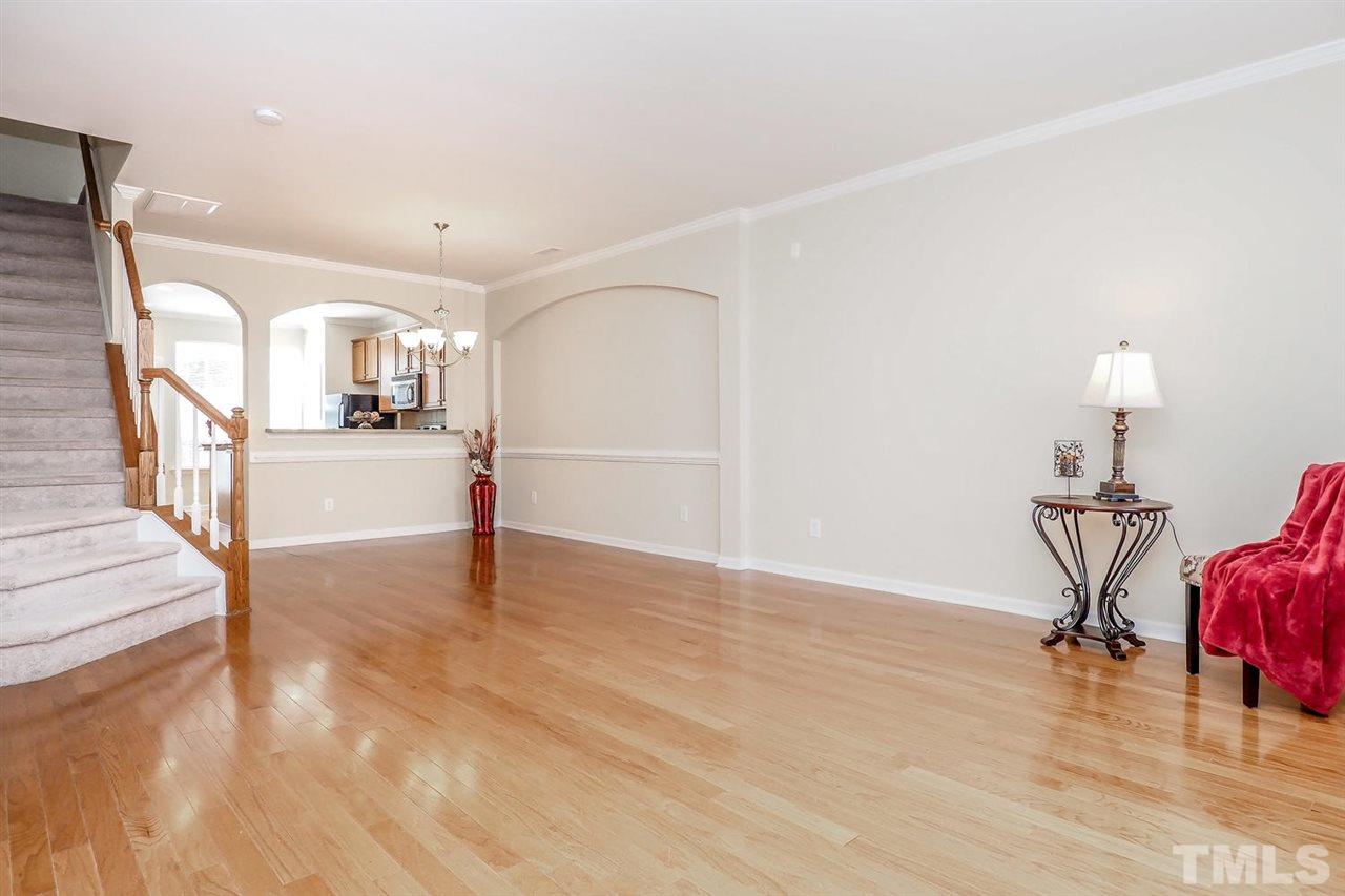 2965 Casona Way Raleigh, NC 27616 - Photo 4 of 25 a view of a livingroom with wooden floor and furniture