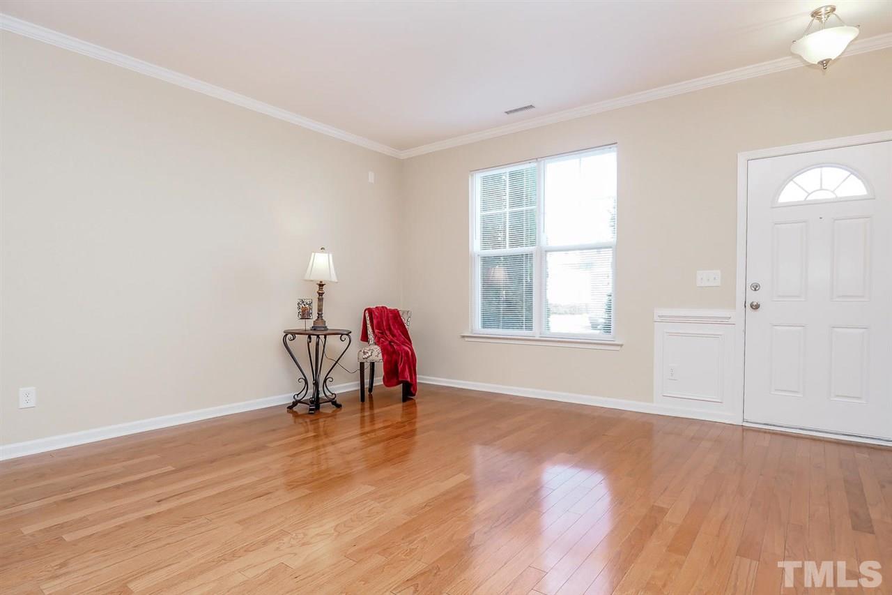 2965 Casona Way Raleigh, NC 27616 - Photo 5 of 25 an empty room with wooden floor and windows