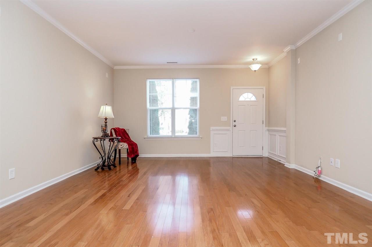 2965 Casona Way Raleigh, NC 27616 - Photo 6 of 25 wooden floor in an empty room with a window
