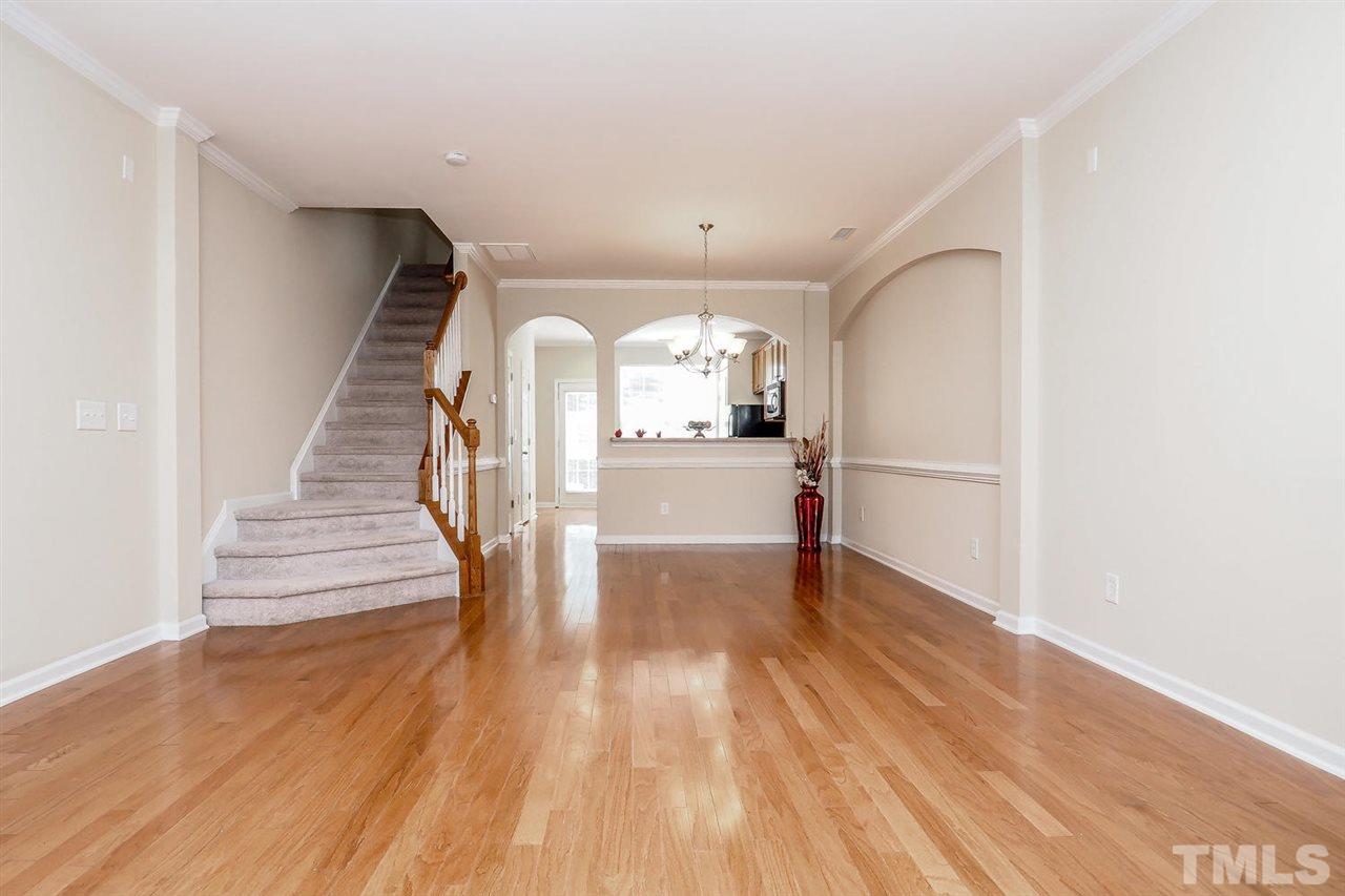 2965 Casona Way Raleigh, NC 27616 - Photo 8 of 25 a view of empty room with wooden floor