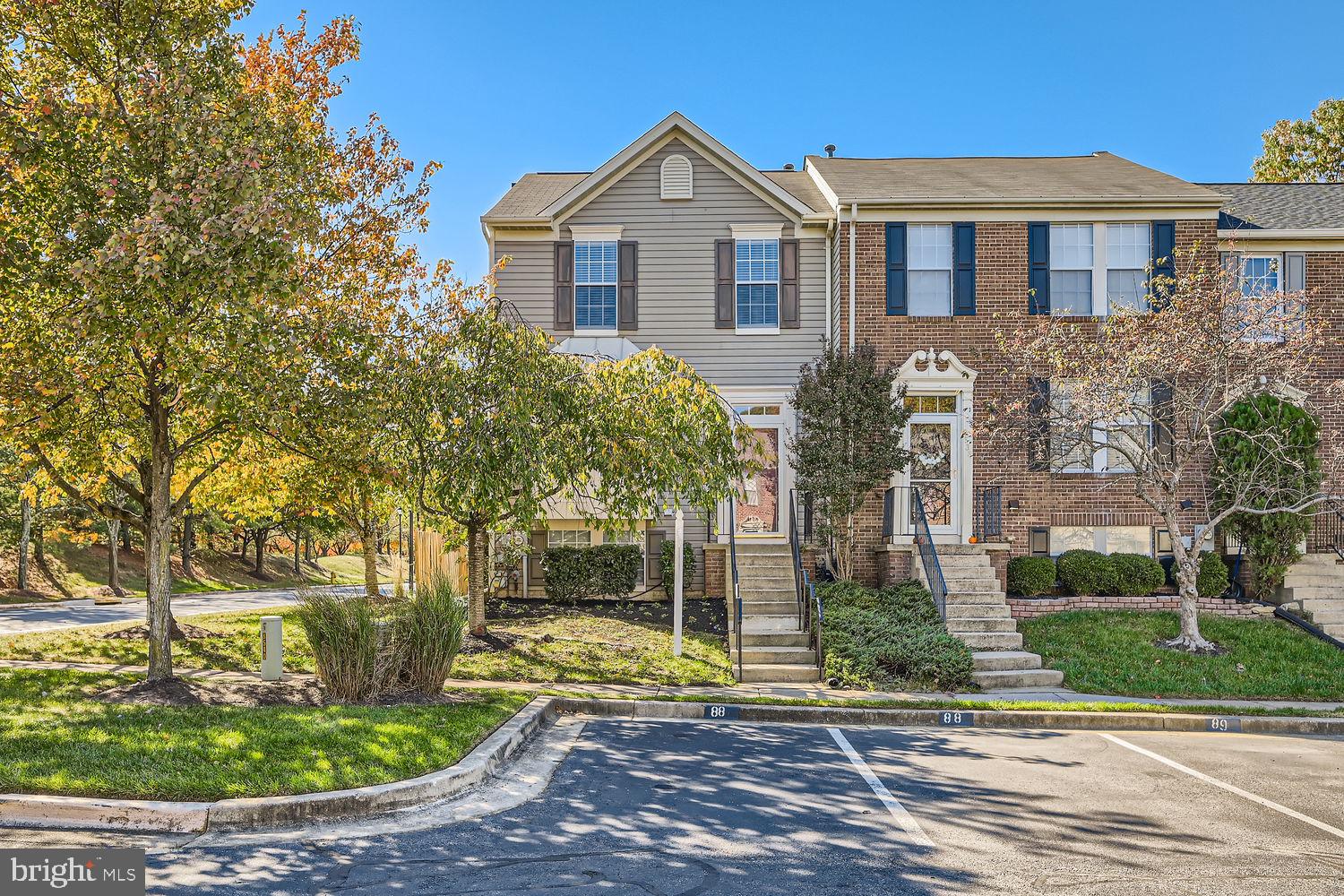 8540 Pine Meadows Drive Odenton, MD 21113 - Photo 2 of 29 a front view of a house with garden