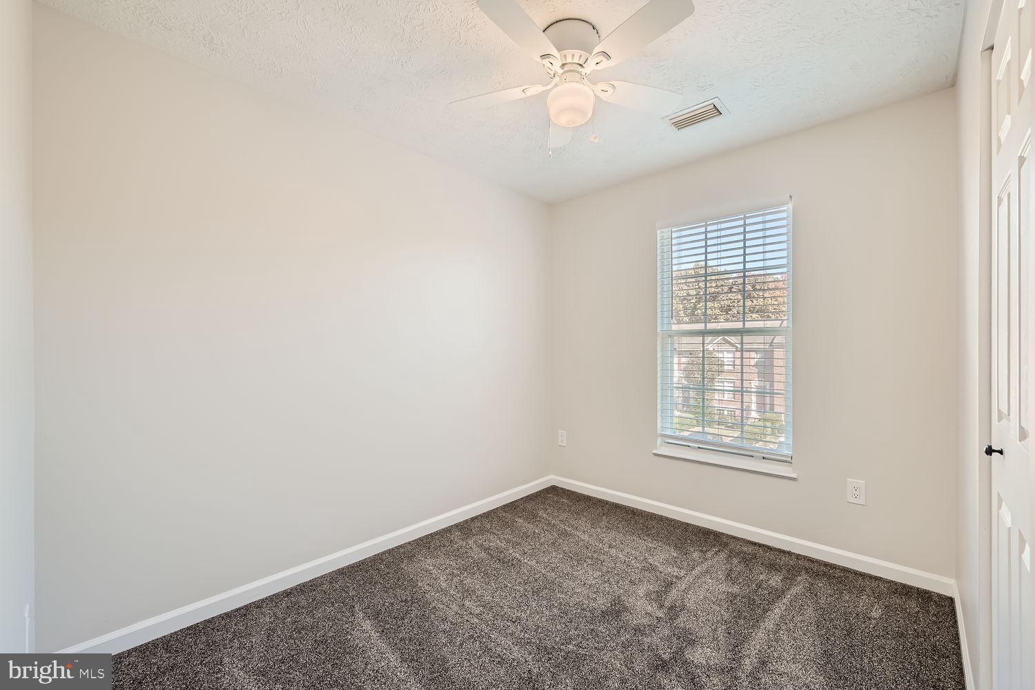 8540 Pine Meadows Drive Odenton, MD 21113 - Photo 21 of 29 an empty room with windows