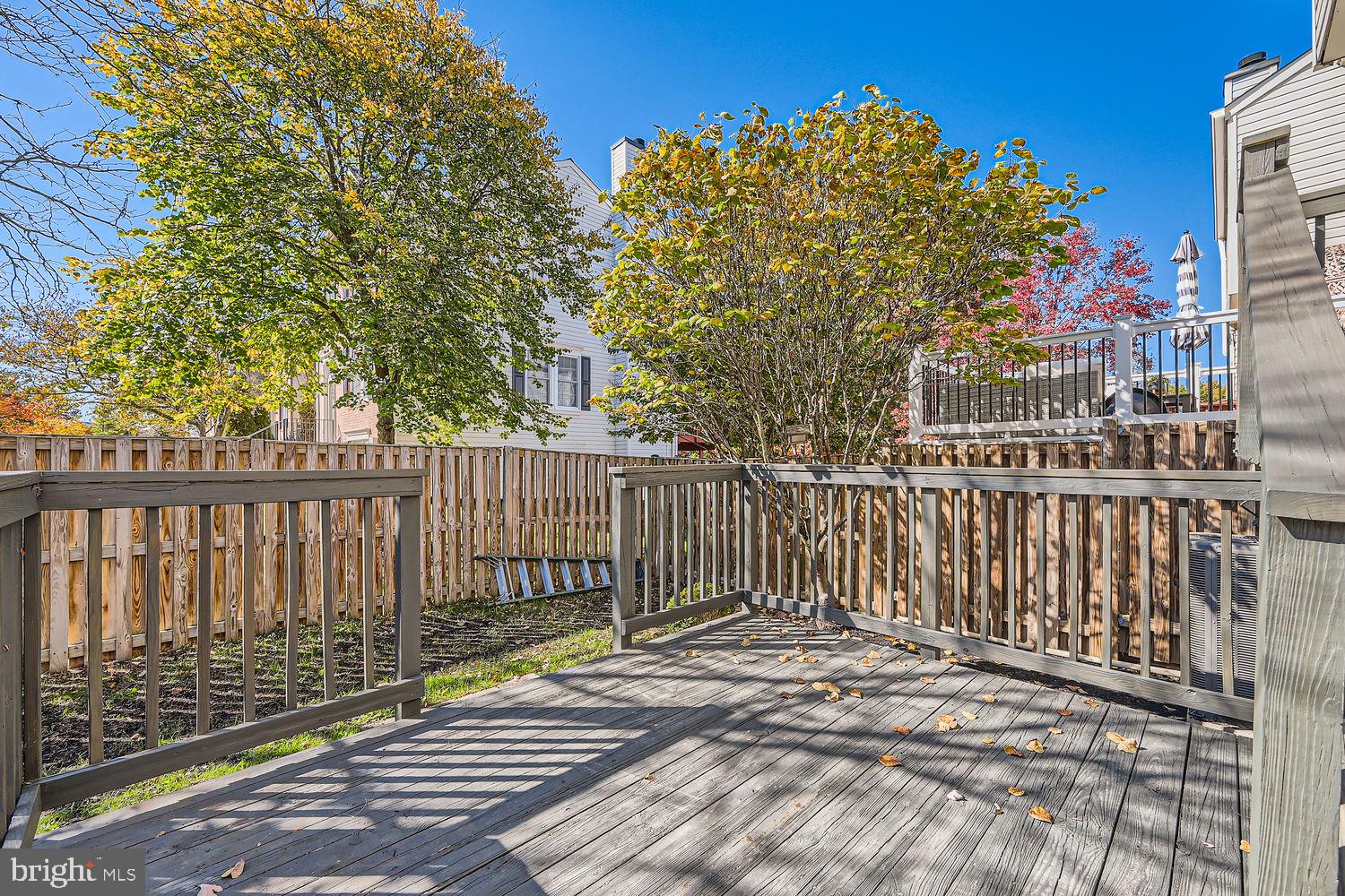 8540 Pine Meadows Drive Odenton, MD 21113 - Photo 27 of 29 a view of a balcony with wooden floor and fence