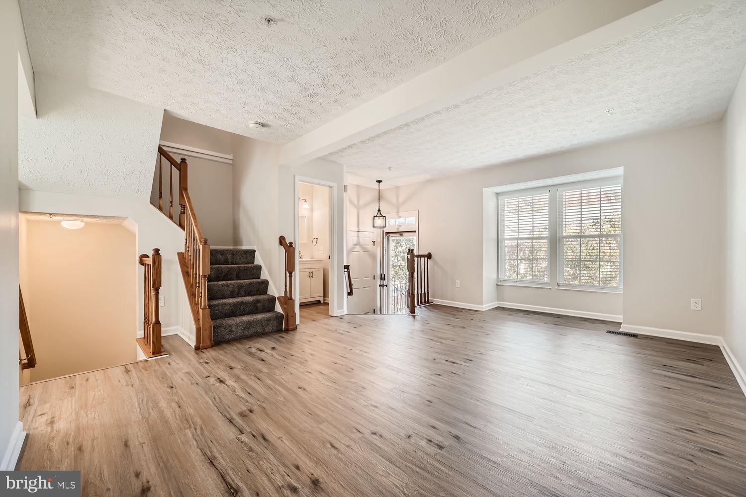 8540 Pine Meadows Drive Odenton, MD 21113 - Photo 4 of 29 a view of empty room with wooden floor and window