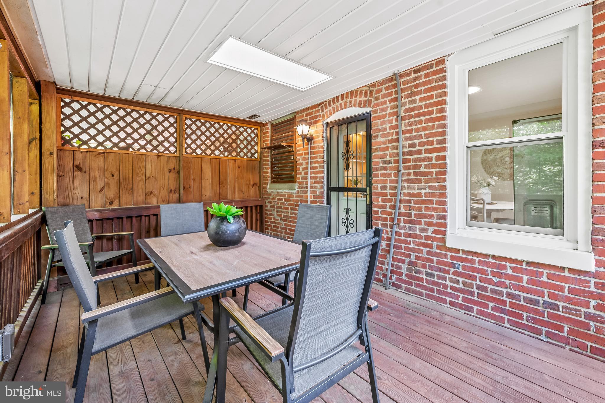 4513 Wilmslow Road Baltimore, MD 21210 - Photo 21 of 65 Screened-in porch with stairs to yard