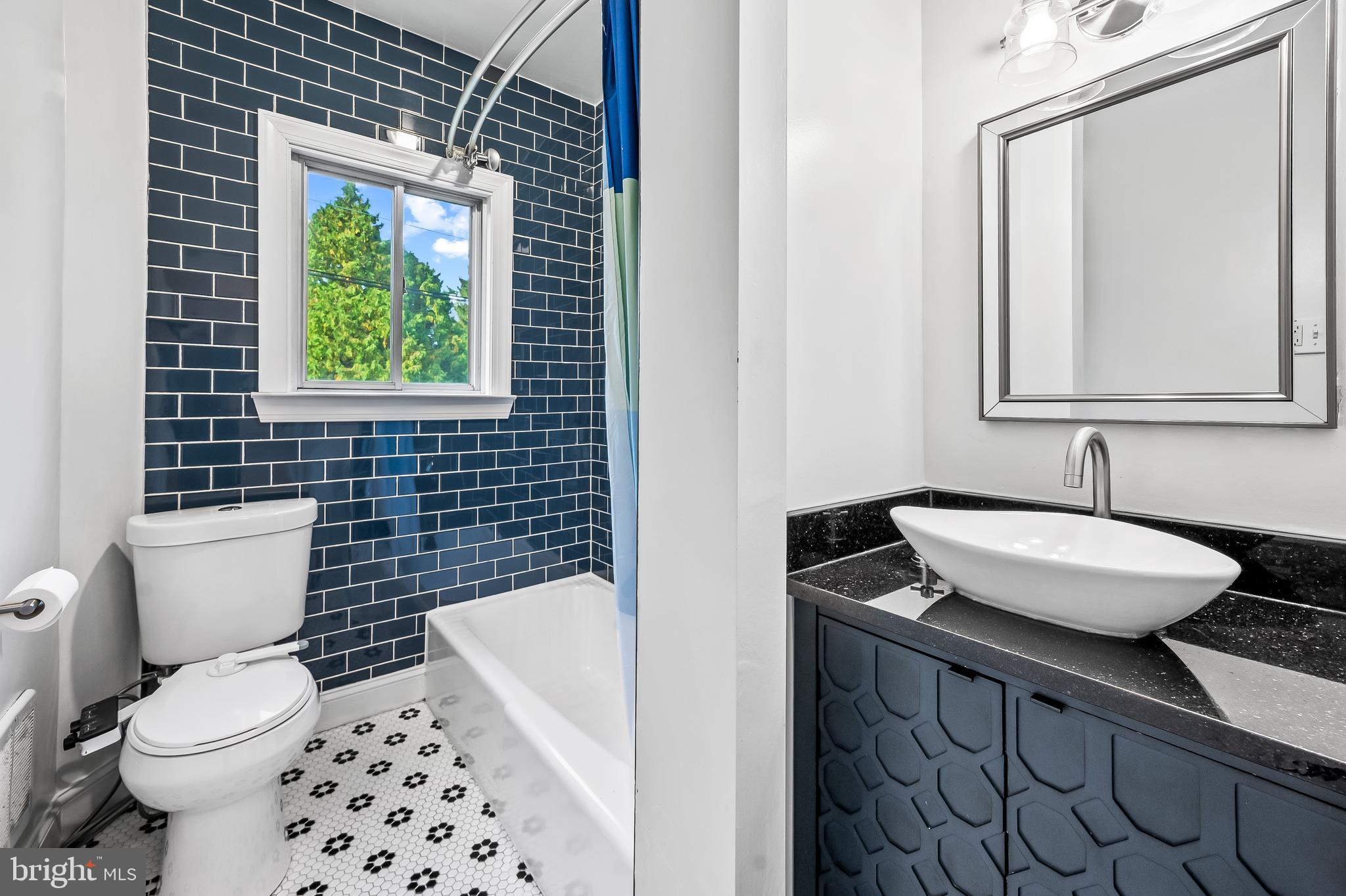 4513 Wilmslow Road Baltimore, MD 21210 - Photo 26 of 65 Full bath on second level - blue tiled walls