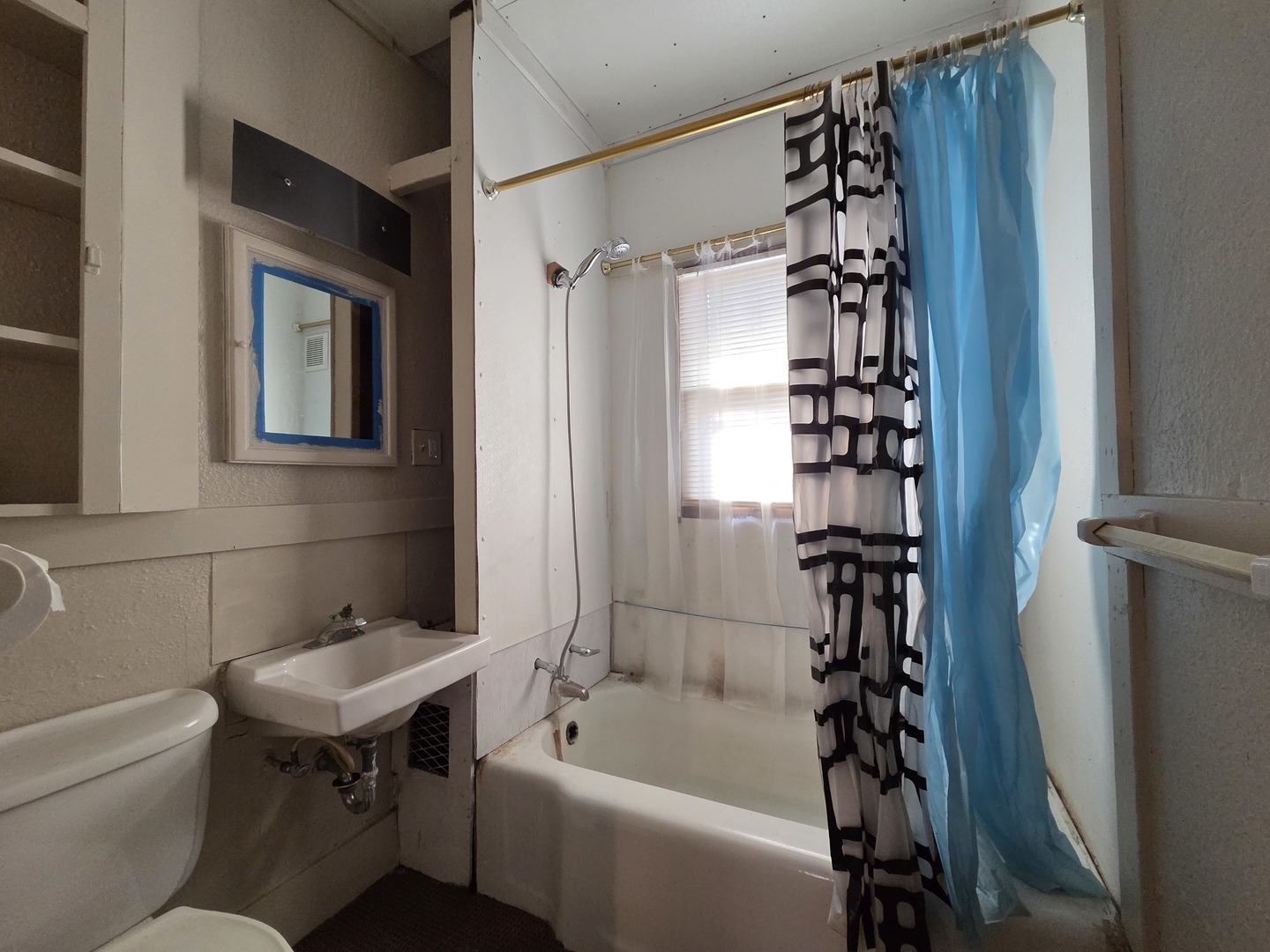 2410 Camanche Avenue Clinton, IA 52732 - Photo 11 of 15 a bathroom with a sink toilet and shower
