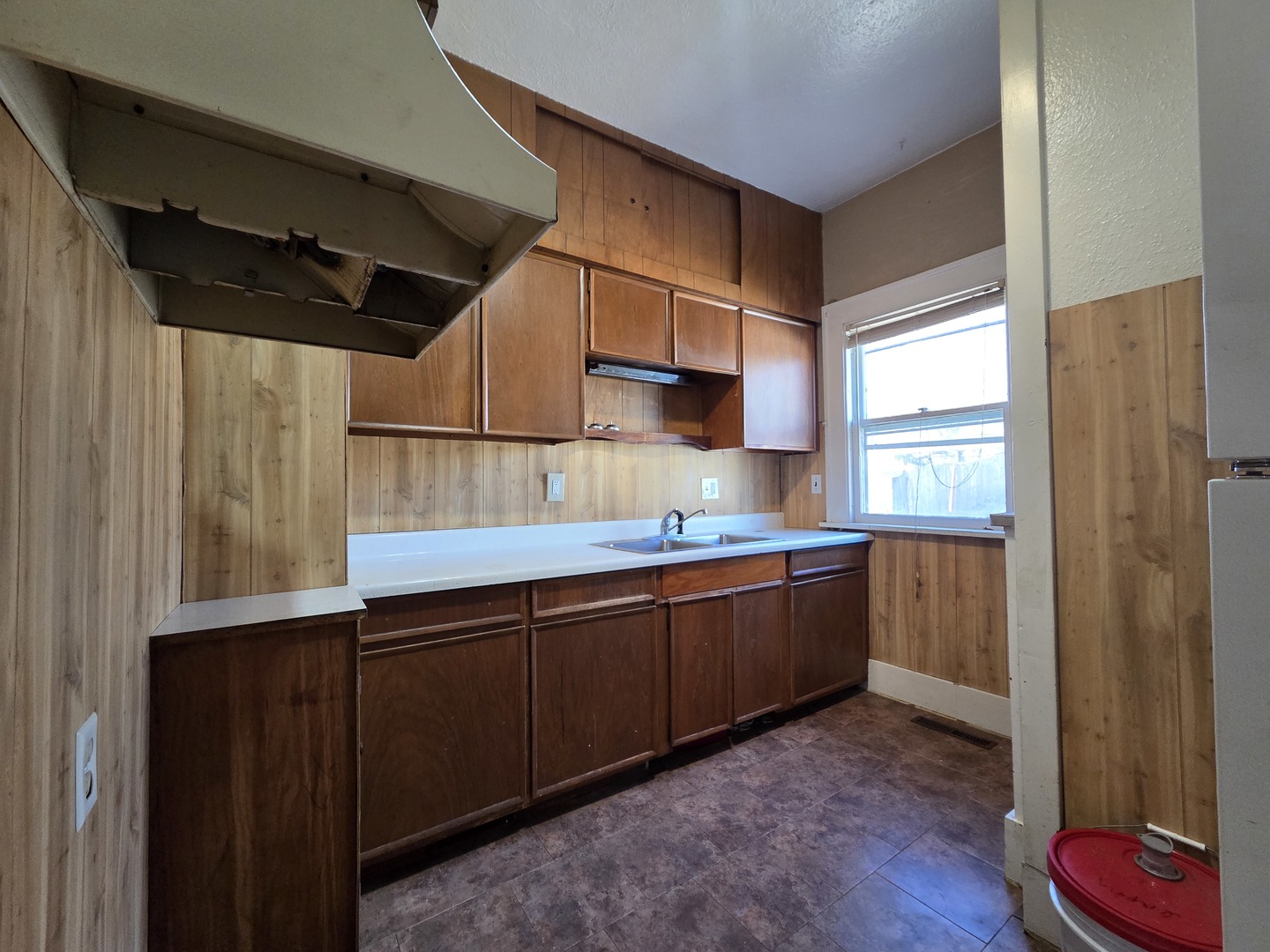 2410 Camanche Avenue Clinton, IA 52732 - Photo 5 of 15 a kitchen with stainless steel appliances granite countertop a sink and wooden cabinets