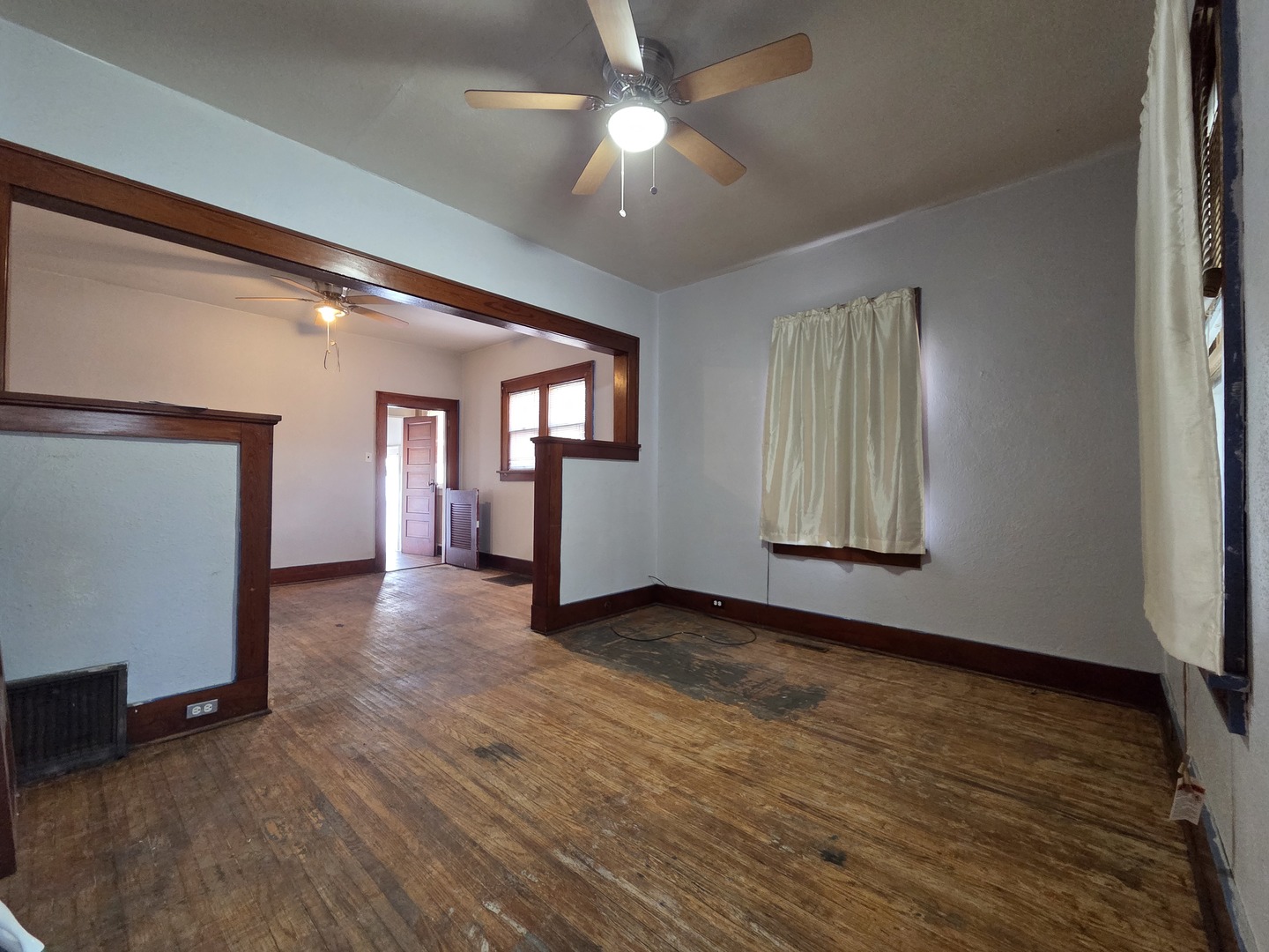 2410 Camanche Avenue Clinton, IA 52732 - Photo 7 of 15 wooden floor in an empty room with a window