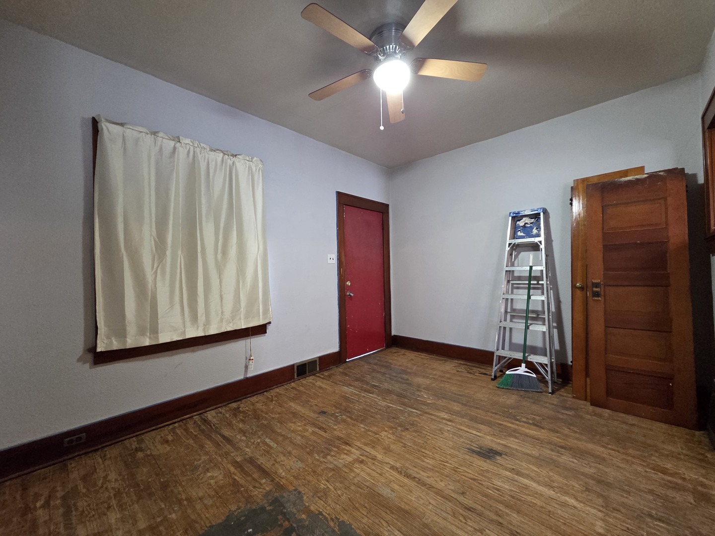 2410 Camanche Avenue Clinton, IA 52732 - Photo 8 of 15 wooden floor in an empty room with a window
