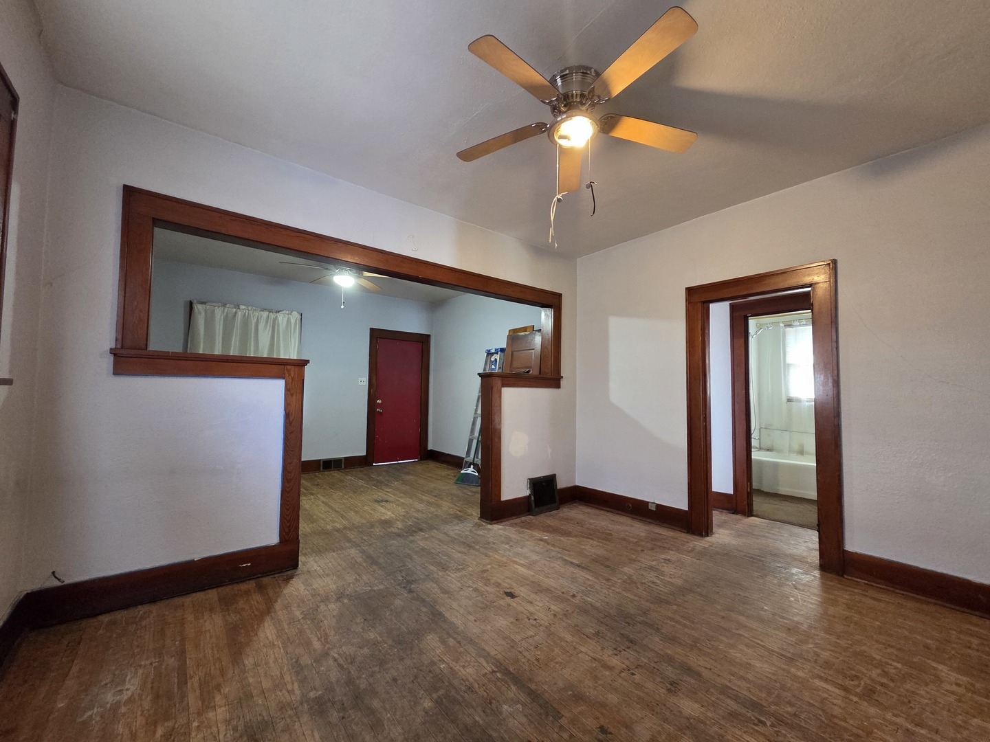 2410 Camanche Avenue Clinton, IA 52732 - Photo 10 of 15 an empty room with ceiling fan and window