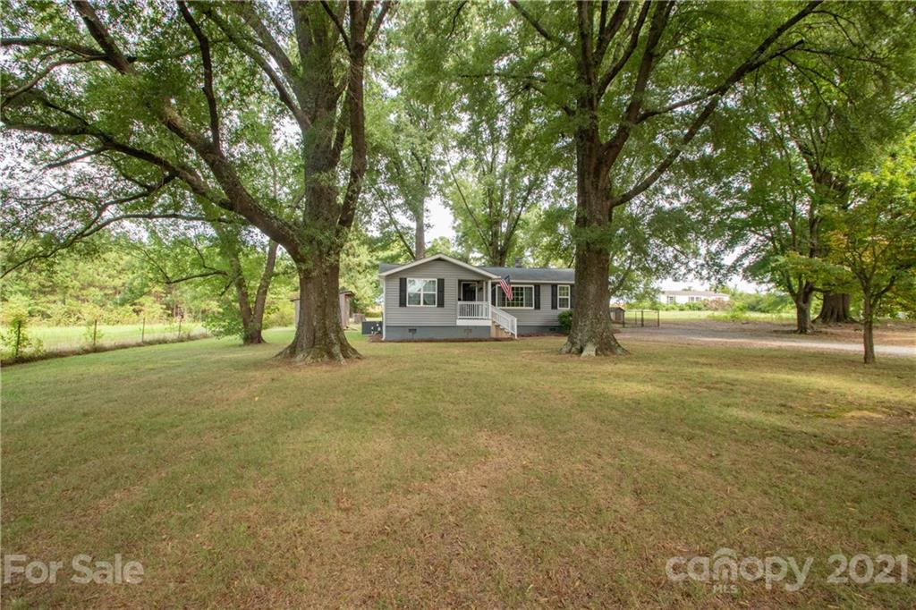 a house with trees in front of it