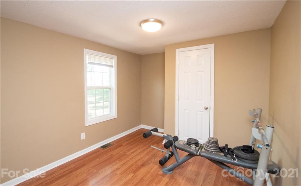 2612 Long Hope Road Monroe, NC 28112 - Photo 23 of 32 a room with gym equipment and a window