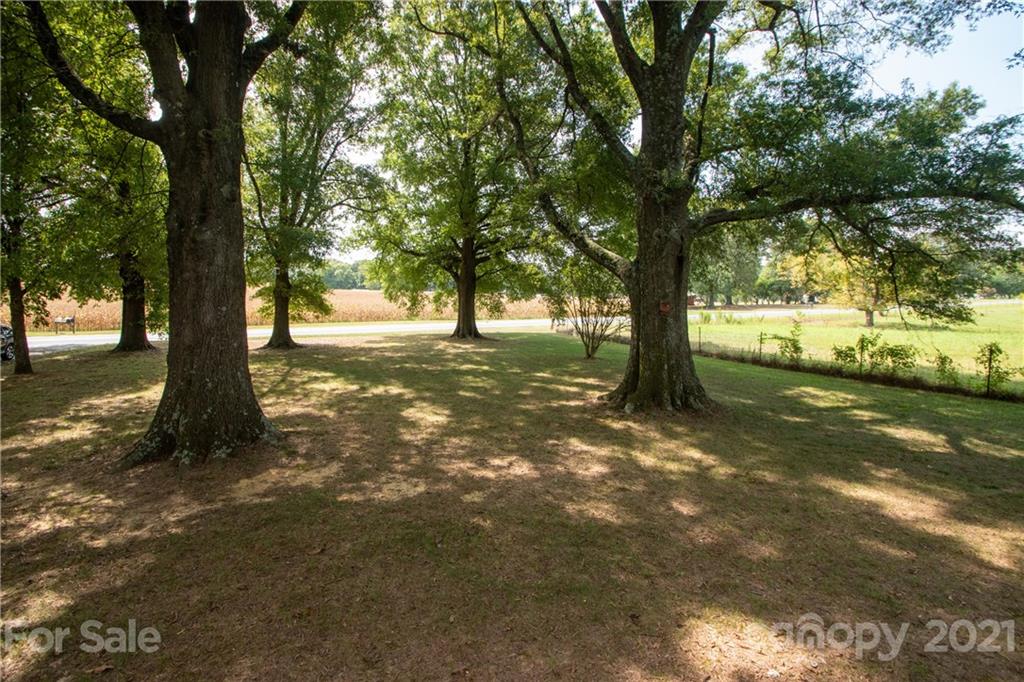 2612 Long Hope Road Monroe, NC 28112 - Photo 4 of 32 a view of a yard with a tree