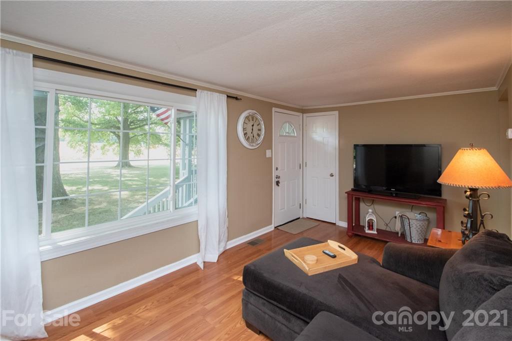 2612 Long Hope Road Monroe, NC 28112 - Photo 6 of 32 a living room with furniture and a flat screen tv