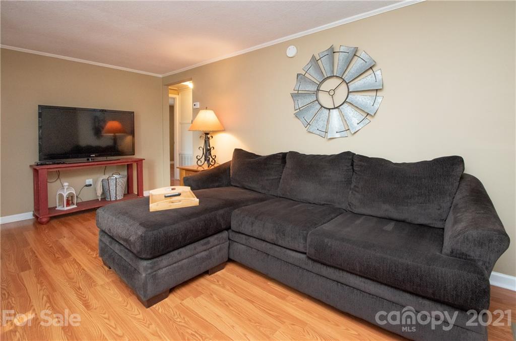 2612 Long Hope Road Monroe, NC 28112 - Photo 7 of 32 a living room with furniture and a flat screen tv