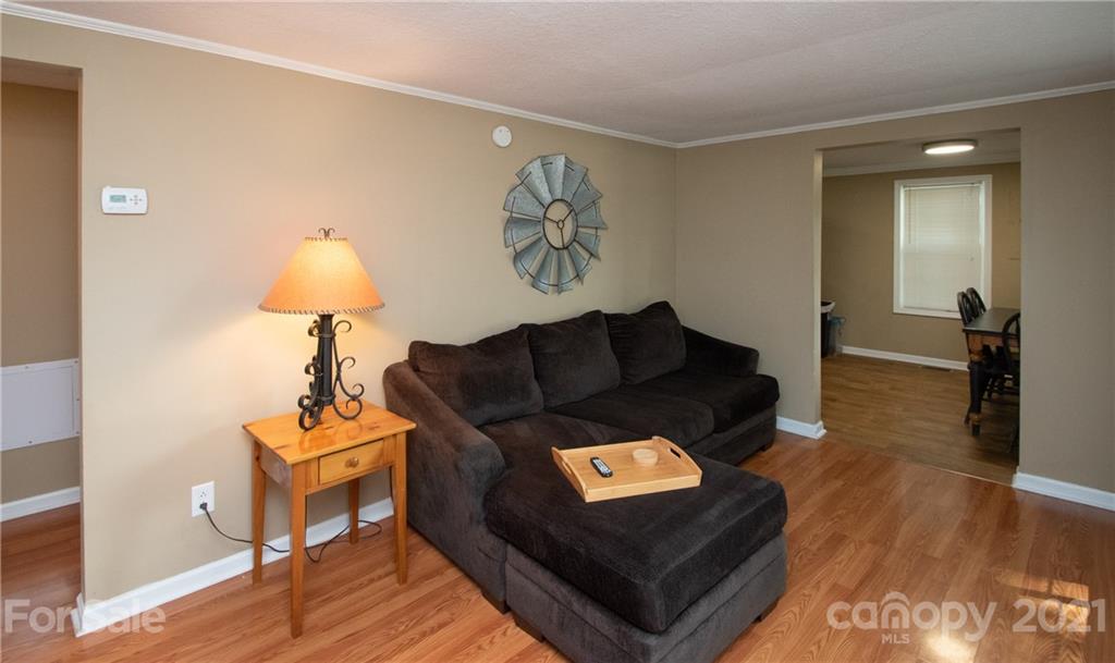2612 Long Hope Road Monroe, NC 28112 - Photo 8 of 32 a living room with furniture and a wooden floor