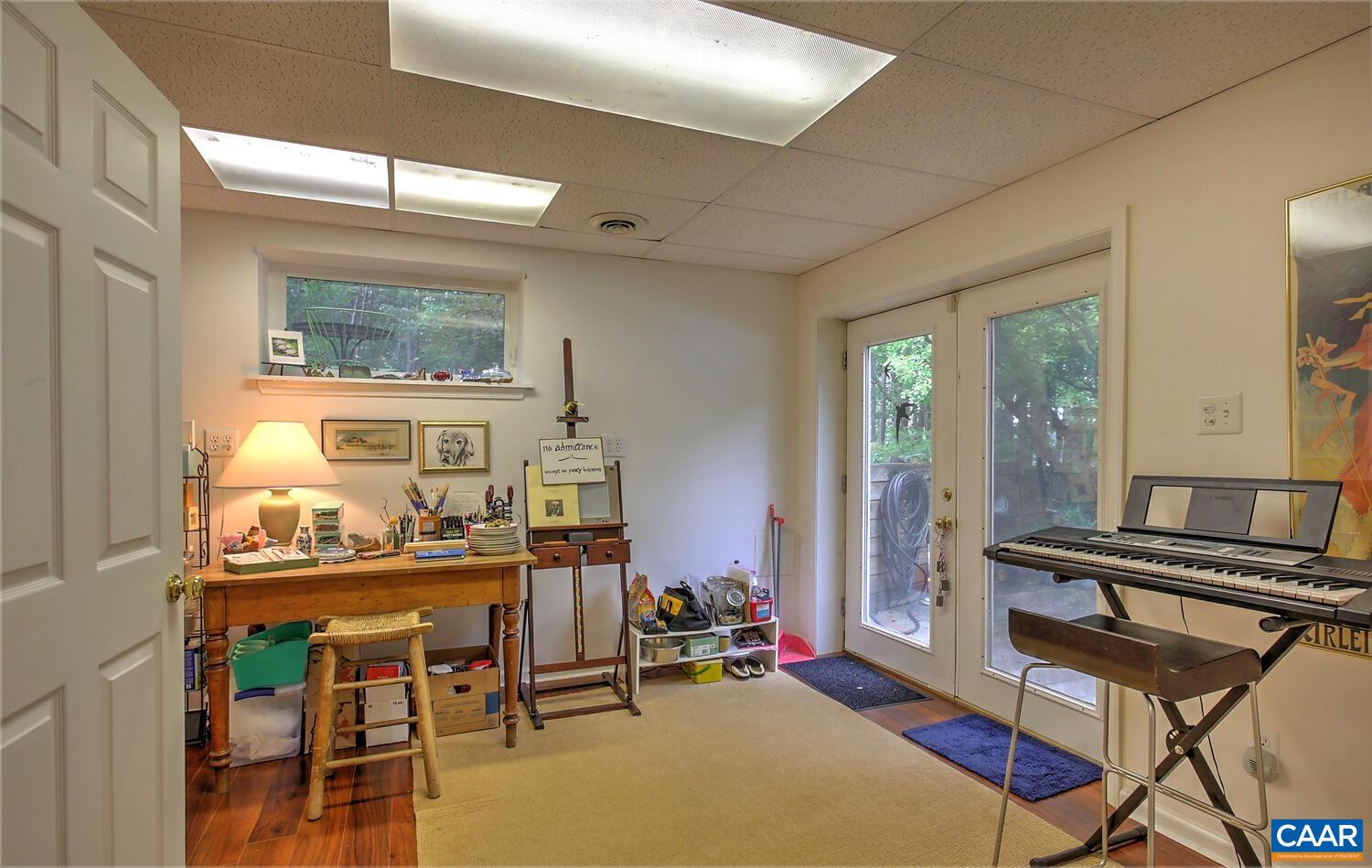 340 Beaver Pond Ridge Troy, VA 22974 - Photo 39 of 53 a room with furniture a dining table and a large window