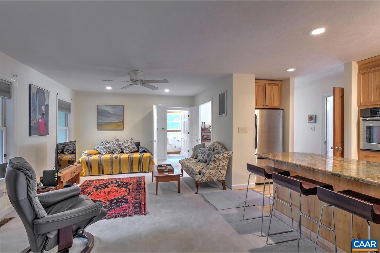 340 Beaver Pond Ridge Troy, VA 22974 - Photo 42 of 53 a living room with furniture and large windows