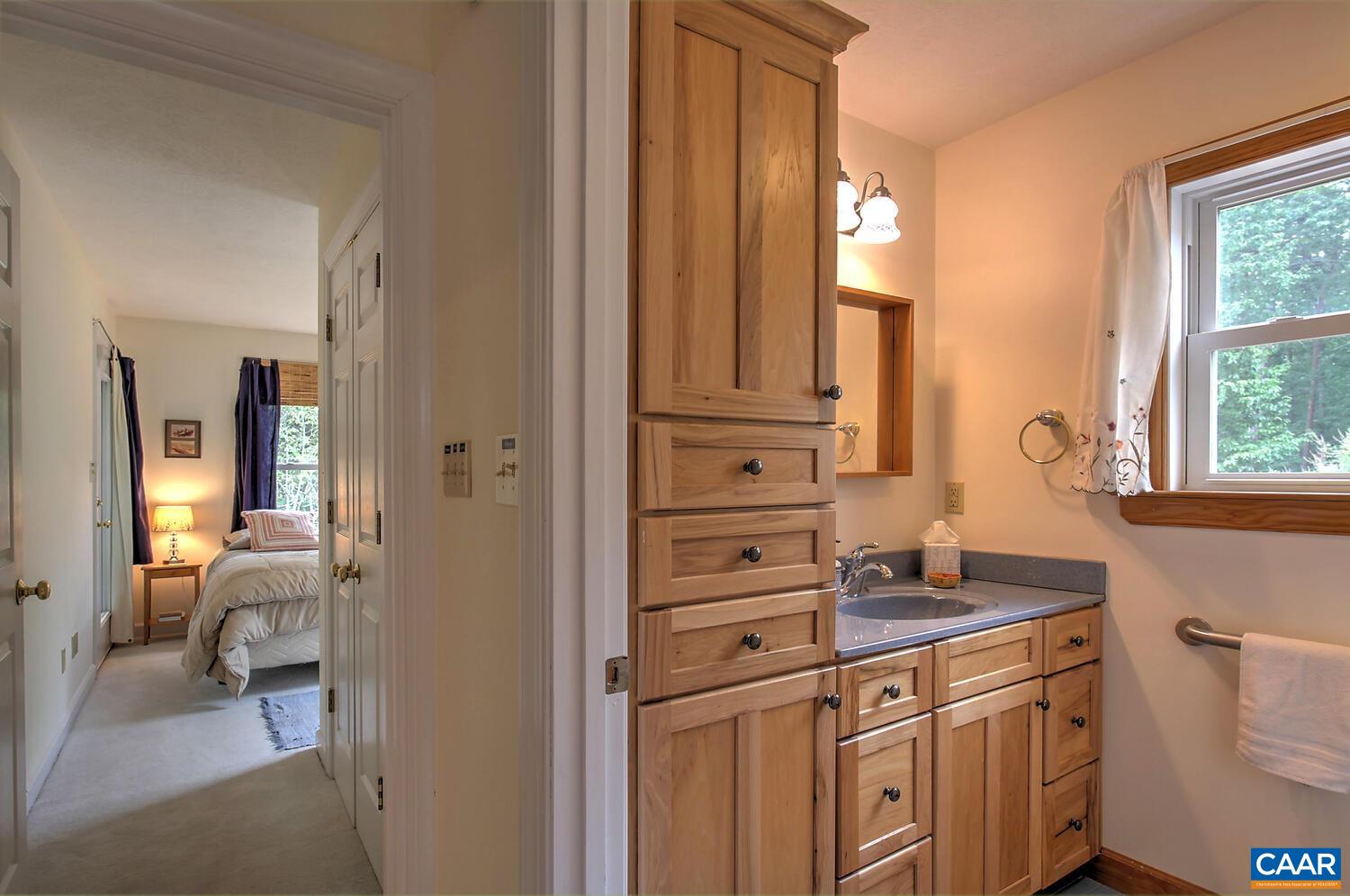 340 Beaver Pond Ridge Troy, VA 22974 - Photo 44 of 53 a bathroom with a sink vanity granite and a mirror