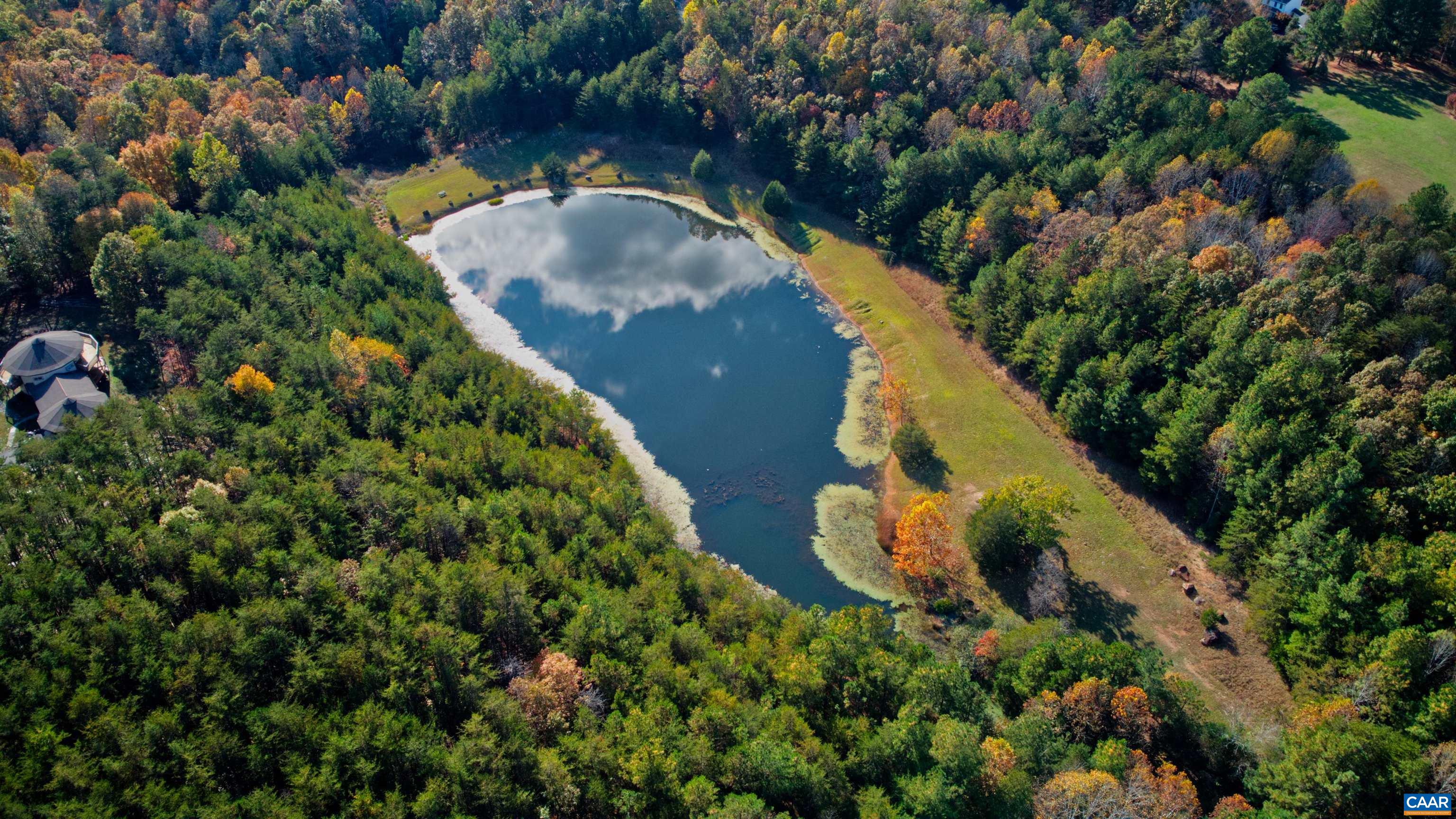 340 Beaver Pond Ridge Troy, VA 22974 - Photo 50 of 53 an aerial view of a house with a yard and trees all around