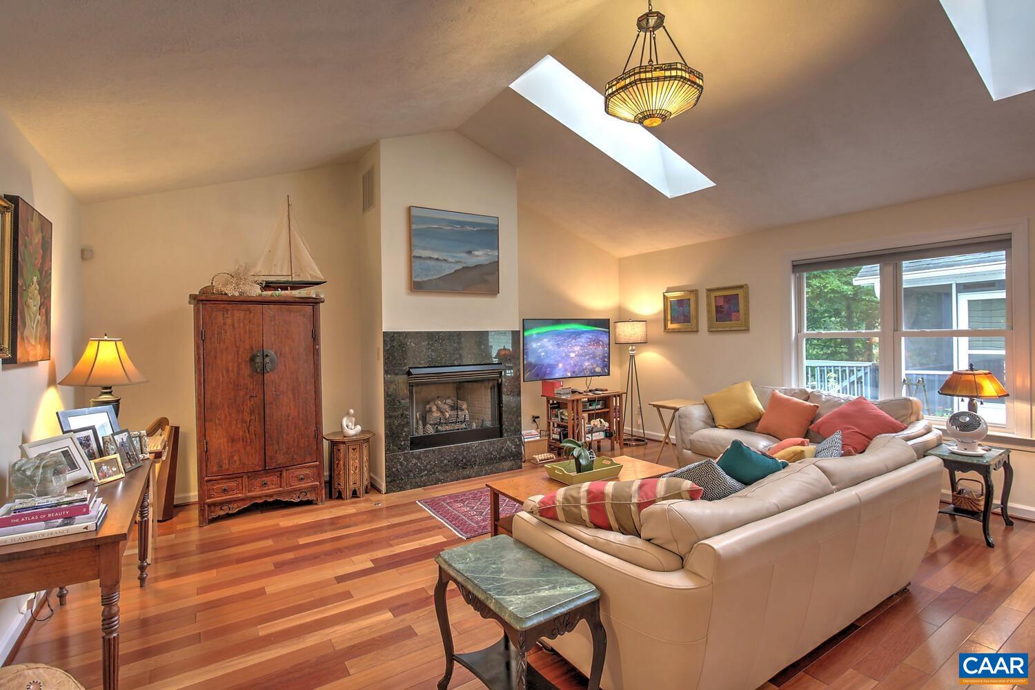 340 Beaver Pond Ridge Troy, VA 22974 - Photo 6 of 53 a living room with furniture a fireplace and a window