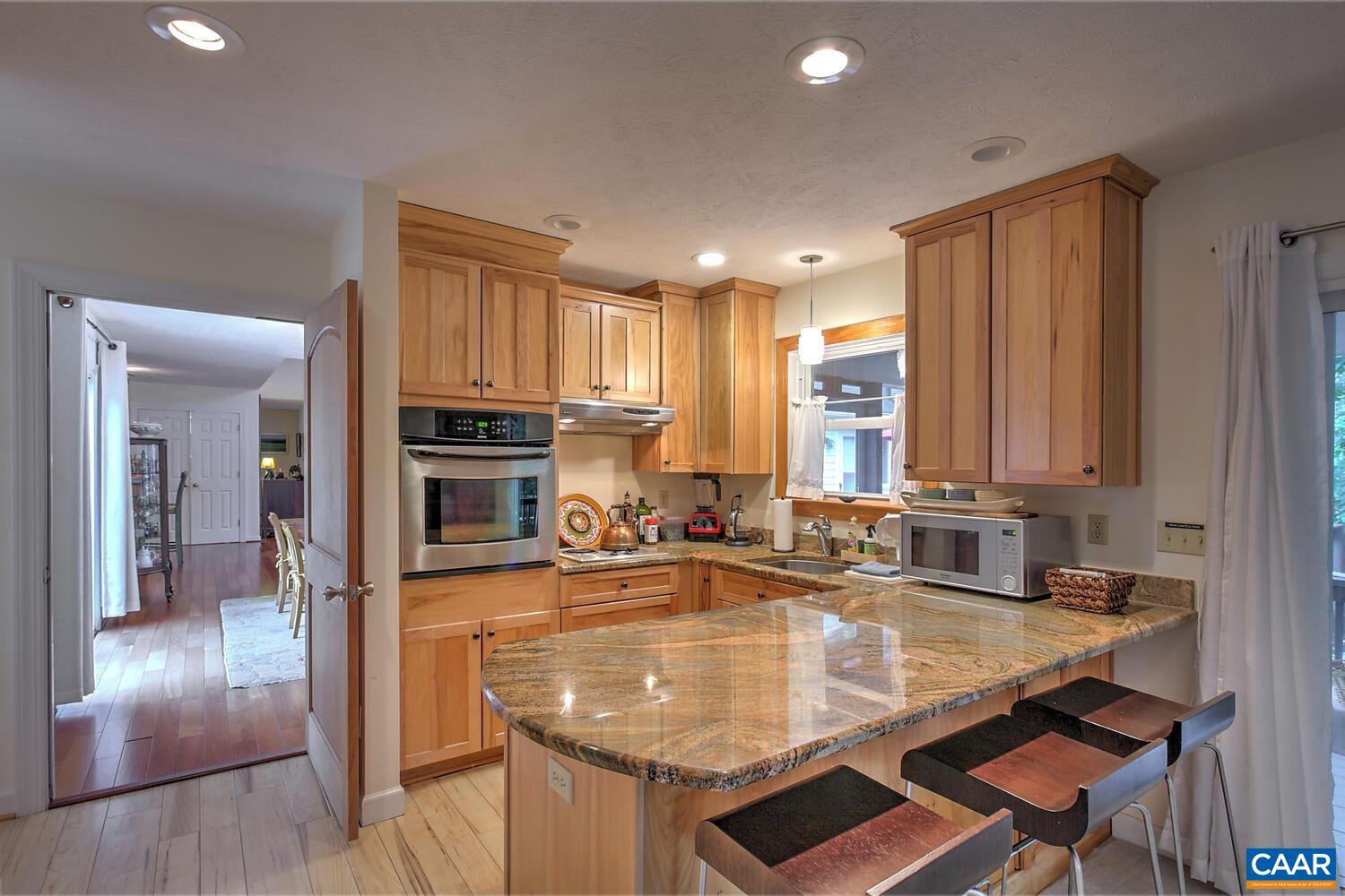 340 Beaver Pond Ridge Troy, VA 22974 - Photo 8 of 53 a kitchen with kitchen island granite countertop a sink stove and cabinets