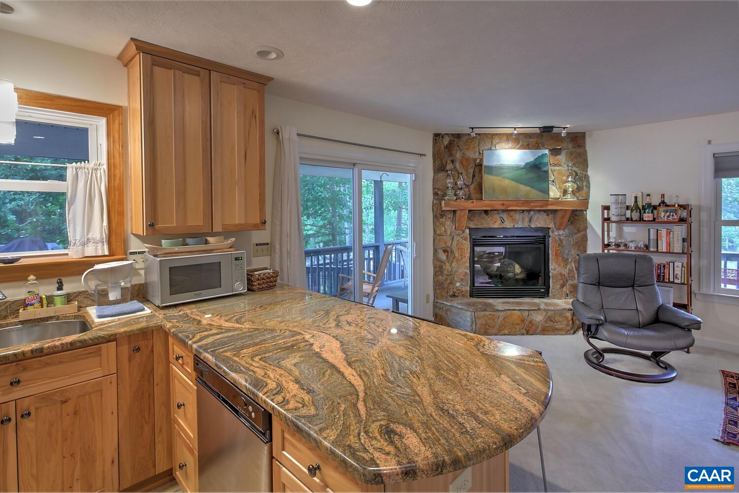 340 Beaver Pond Ridge Troy, VA 22974 - Photo 9 of 53 a living room with a fireplace and a flat screen tv