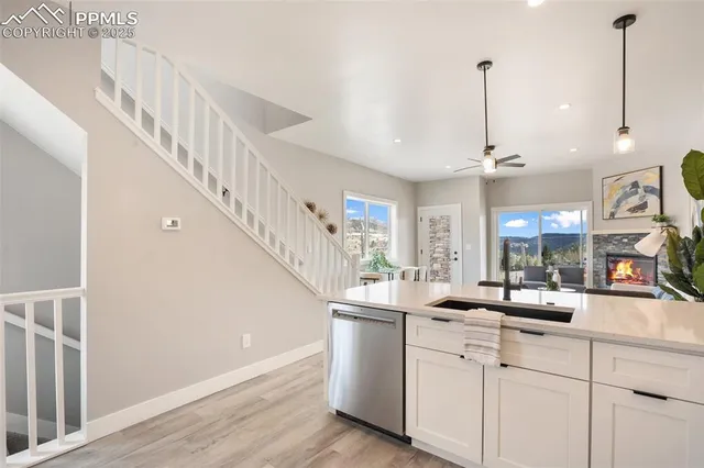a room with lot of cabinets and white appliances