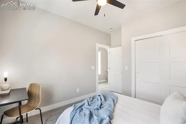 a bedroom with a bed and a chair