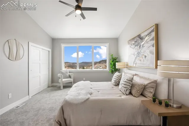 a bedroom with a large bed and a window