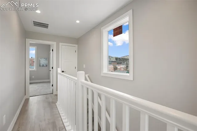 a view of hallway with livingroom