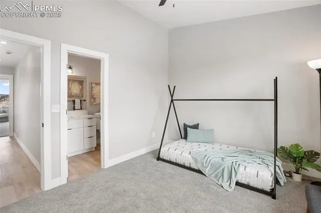 a bedroom with a bed and a mirror