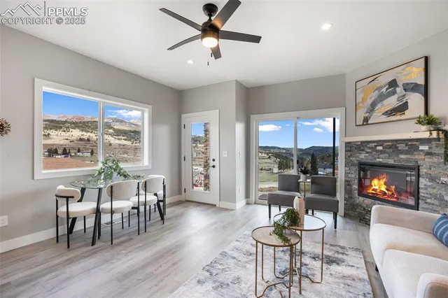 a living room with furniture and a large window