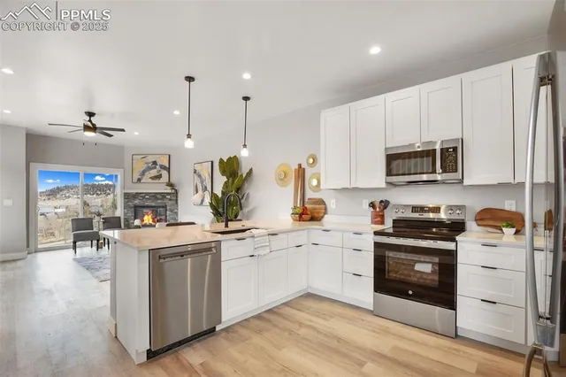 a kitchen with a sink stove and cabinets
