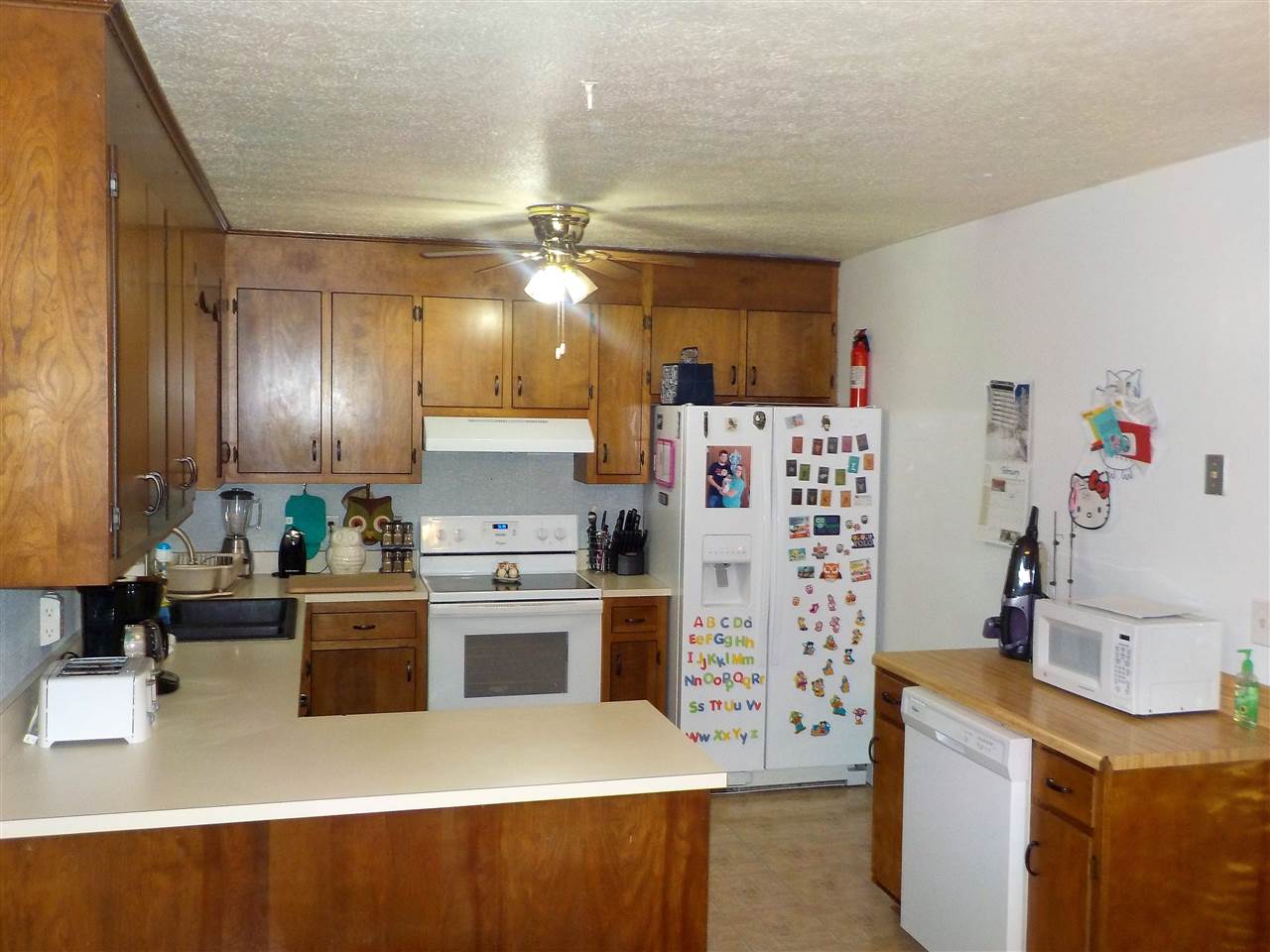 16 Ox Road Waynesboro, VA 22980 - Photo 3 of 6 a kitchen with a refrigerator sink and stove top oven